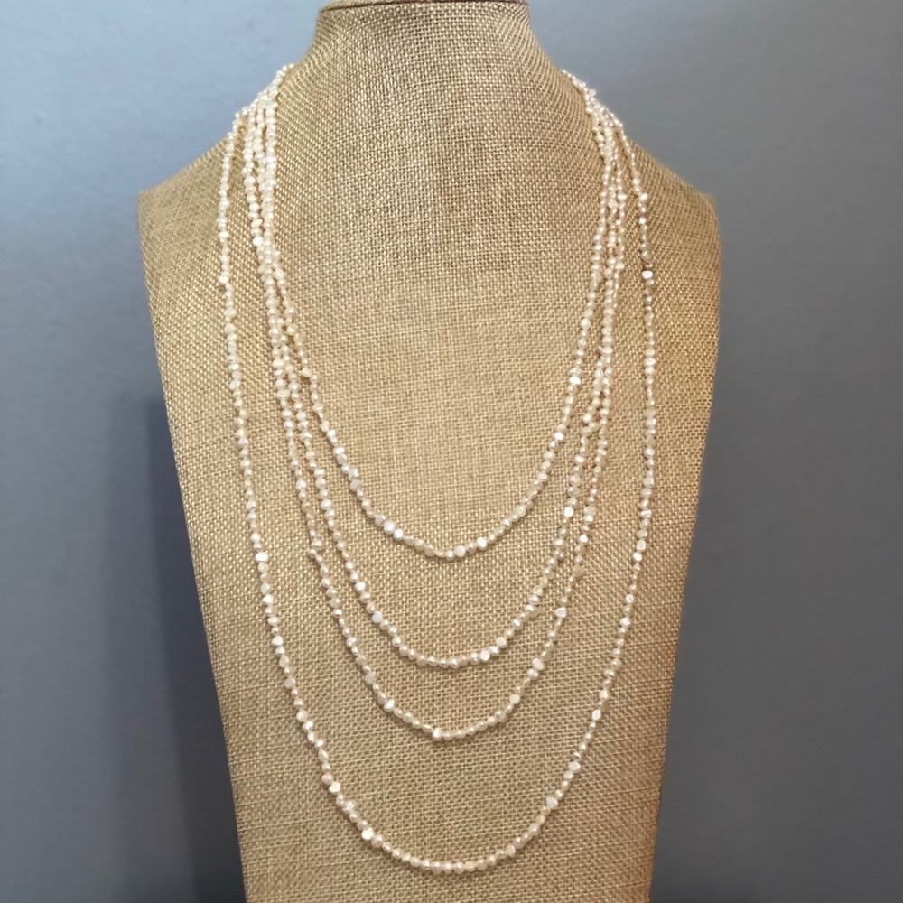 56 inch strand of cultured ivory pearls